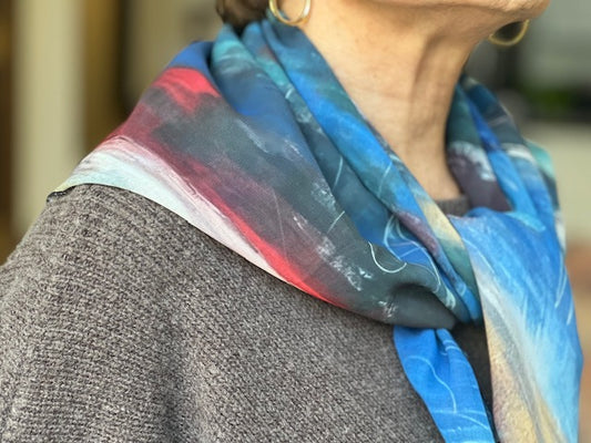 This scarf is a beautiful and vibrant painting I created then designed into wearable art titled "Love is Blue" but in a traditional square measuring 31X31.  The blues really pop in this scarf! Sophisticated and elegant, these scarves are made from vegan georgette fabric that feels like silk, but with more durability.