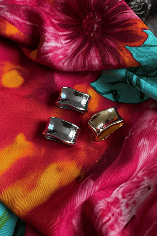 3 scarf rings on a colorful scarf background inspired floral designs nyc llc