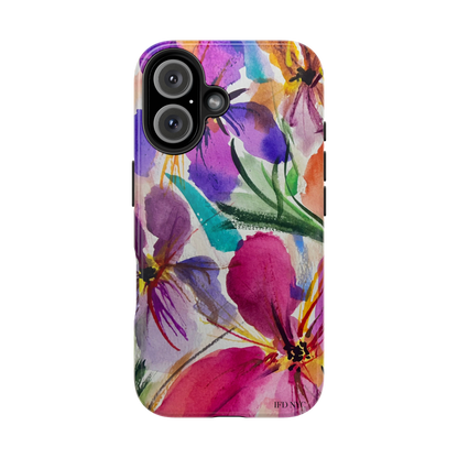 A protective phone case featuring a vibrant watercolor floral print with pink, purple, orange, and green hues, shown on a plain white background. iphone 16