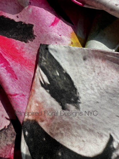 Close-up of fabric with floral design and 'Inspired Floral Designs NYC' branding peace scarf  copyright