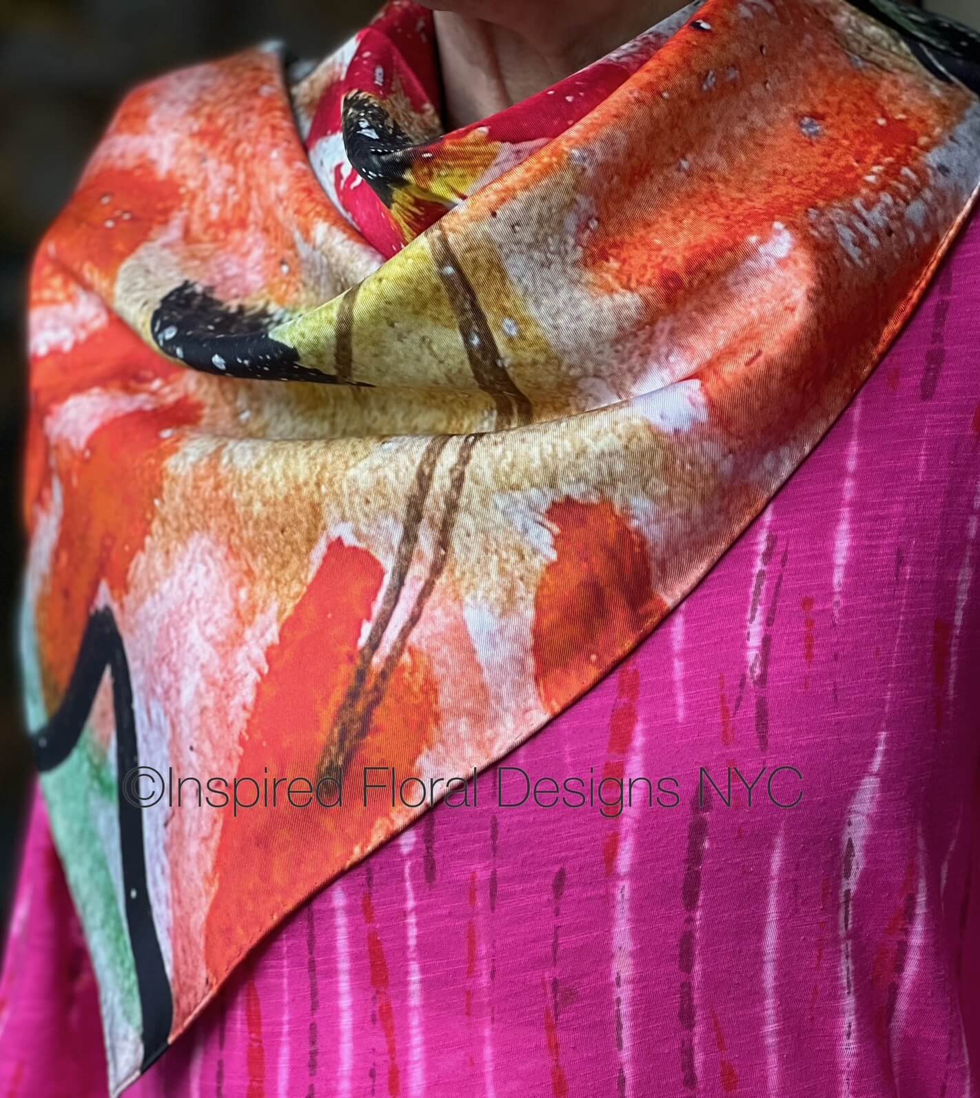 Colorful floral scarf titled peace in the edit: floral art in silk with 'Inspired Floral Designs NYC' branding on a pink background copyright
