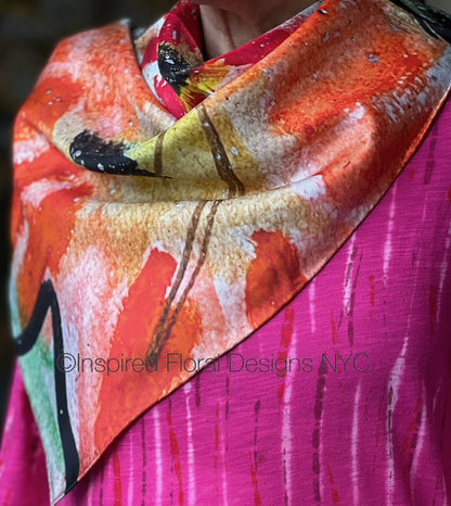 Colorful floral scarf titled peace in the edit: floral art in silk with 'Inspired Floral Designs NYC' branding on a pink background copyright