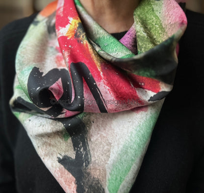 Colorful floral scarf with abstract design worn by a person for inspired floral designs nyc copyright peace scarf the edit floral art in silk