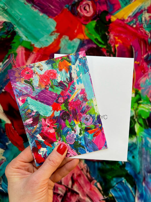 Colorful abstract painting titled petals unleashed by inspired floral designs nyc held by a hand with red nail polish against a multicolored background copyright