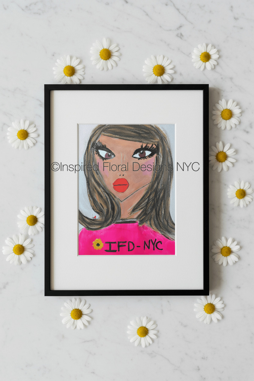 Framed artwork of a woman's face with 'IFD NYC' on a white background with daisies by whitney inspired floral designs nyc copyright 