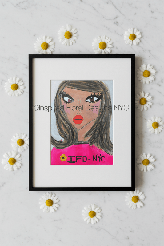 Framed artwork of a woman's face with 'IFD NYC' on a white background with daisies by whitney inspired floral designs nyc copyright 