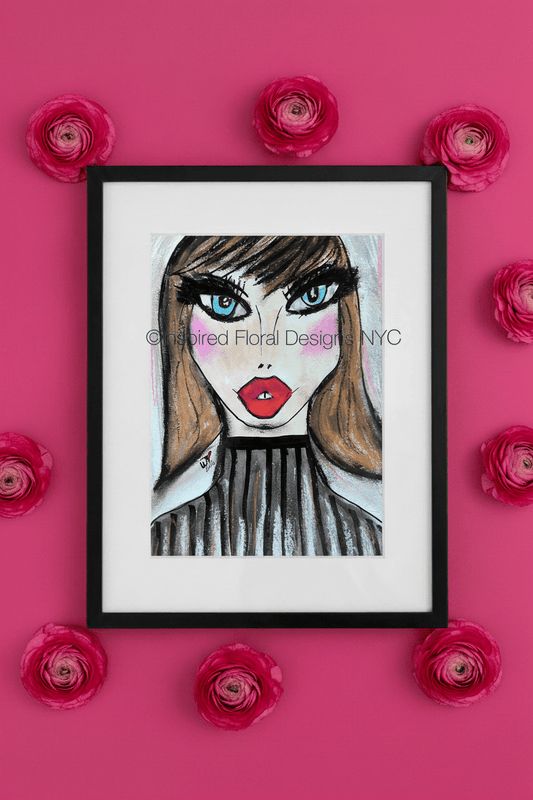 Framed artwork of a stylized face with red lips and blue eyes, surrounded by pink flowers on a pink background. by whitney inspired floral designs nyc llc copyright