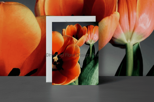 Floral design with orange tulips on a gray background by Whitney  - Inspired Floral Designs NYC copyright  