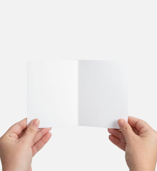 Two hands holding a white card against a white background