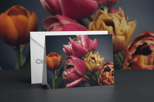 Greeting card with floral design in front of colorful tulips by whitney at inspired floral designs nyc llc copyright