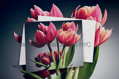 Pink tulips with a card featuring a similar floral design on a dark background by Whitney at Inspired Floral Designs NYC LLC copyright