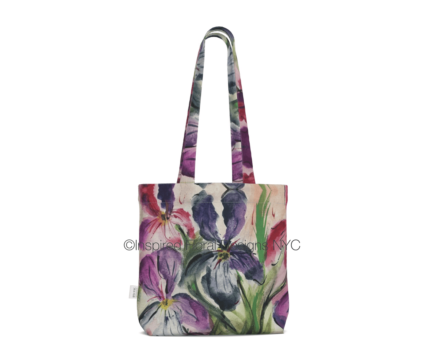 Floral tote bag with a visible brand logo on a white background inspired floral designs nyc