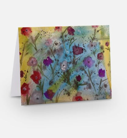 A greeting card featuring a vibrant, abstract floral watercolor painting titled Floral Symphony by Whitney at Inspired Floral Designs NYC