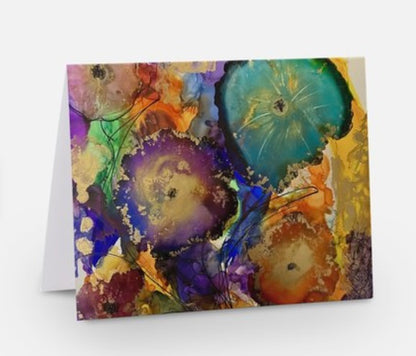 A vibrant greeting card featuring a floral design with a mix of purple, blue, green, and yellow colors on a glossy finish by Whitney titled Splendor for Inspired Floral Designs NYC