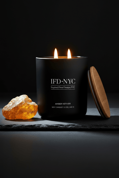 Black candle with 'IFD NYC' branding on a dark background