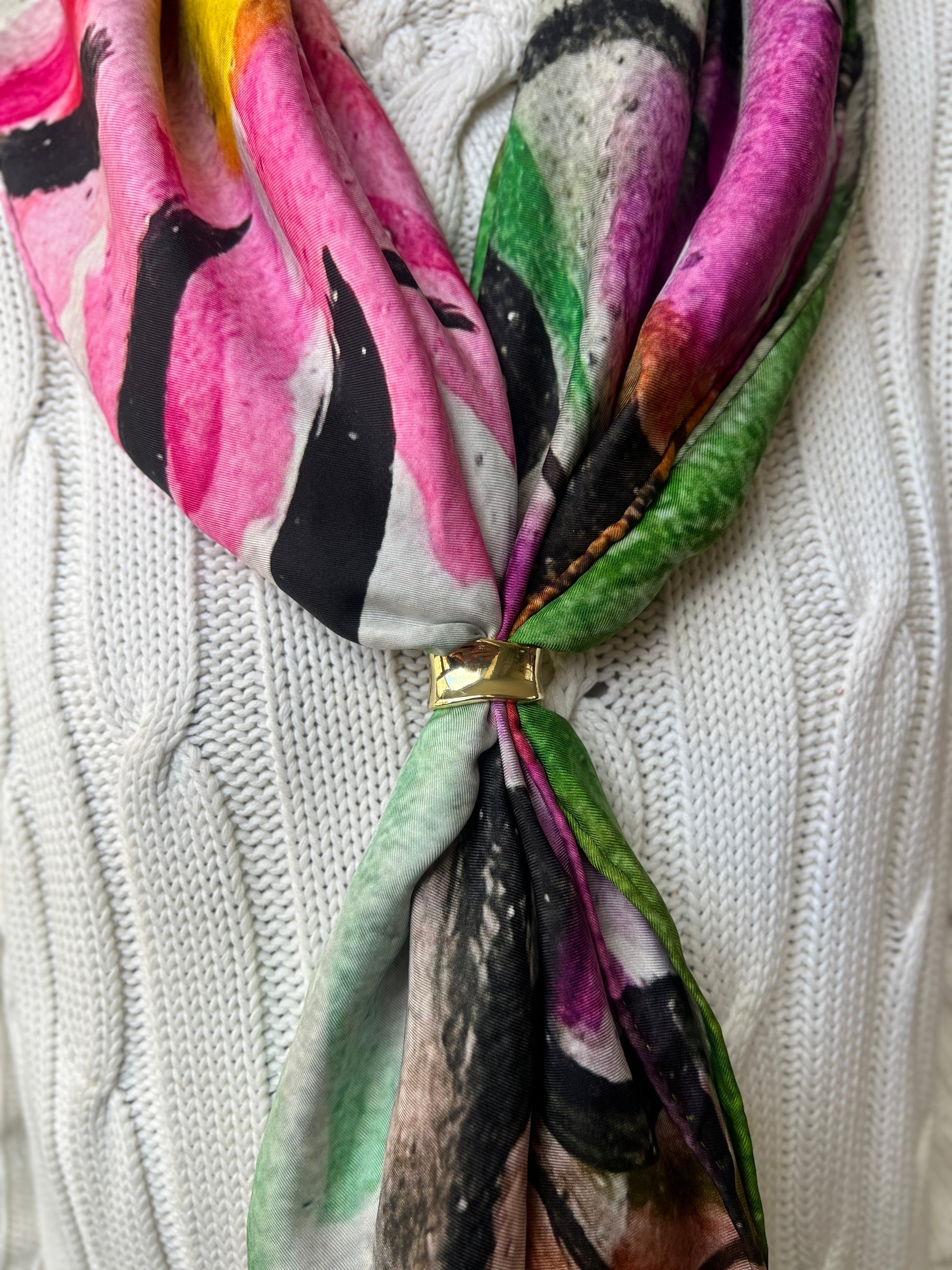 Colorful silk twill scarf with floral pattern tied around a white knitted sweater called PEACE by Inspired Floral Designs NYC 