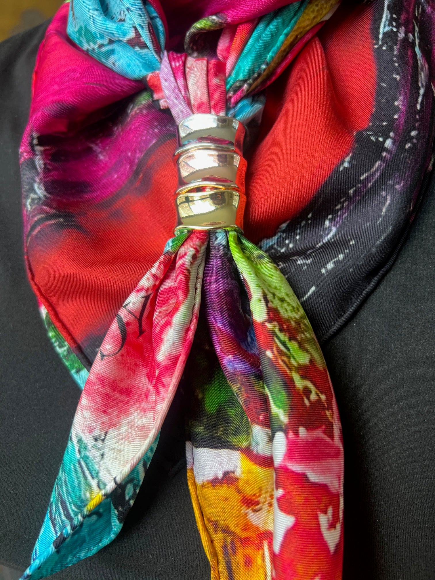 Colorful silk twill scarf abstract floral with a decorative 3 scarf rings on a black background by inspired floral designs nyc- scarf is titled petals in the wild