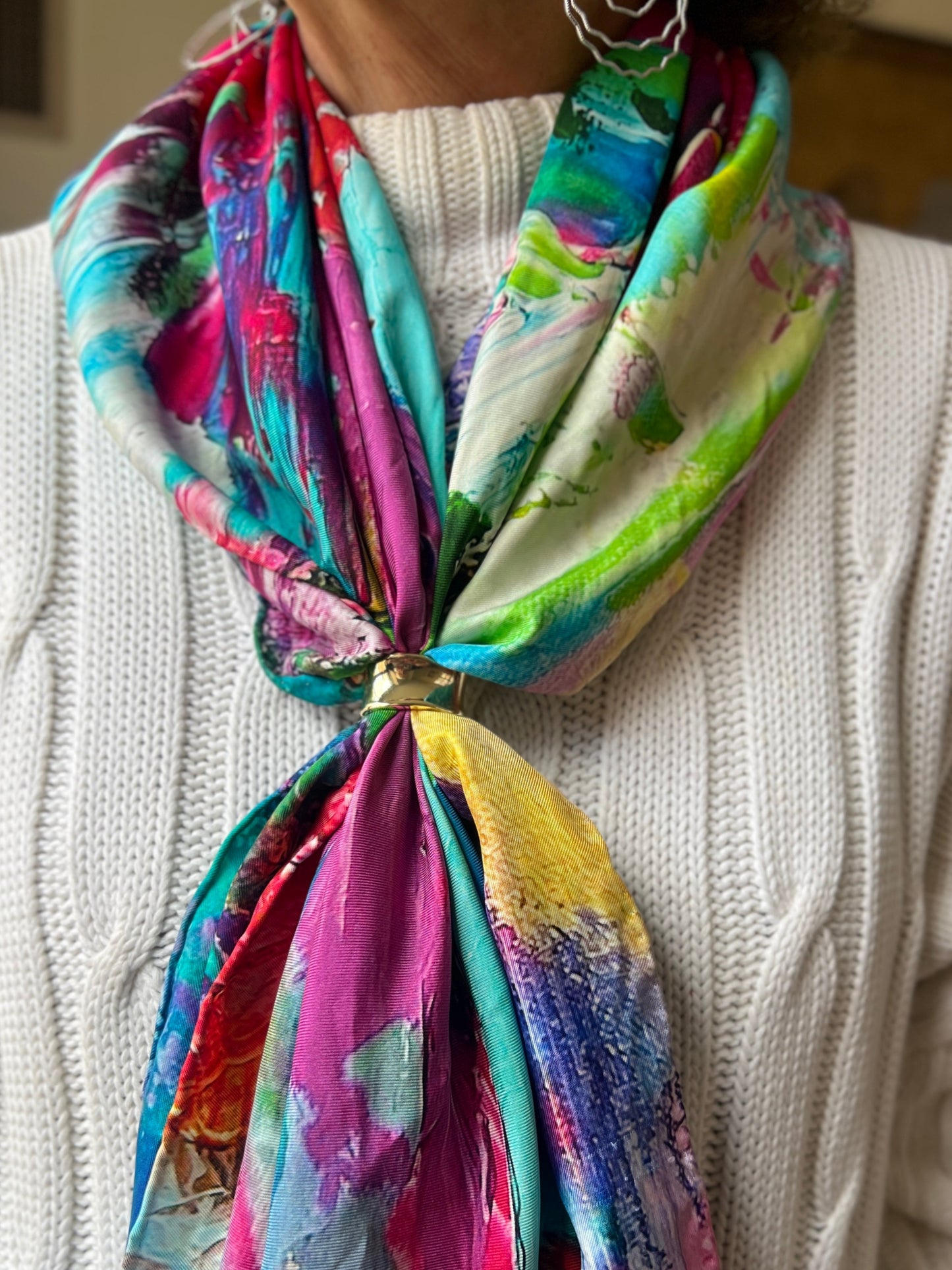 Colorful silk twill scarf with a floral abstract pattern worn over a white sweater-unleashed petals by Inspired Floral Designs NYC 