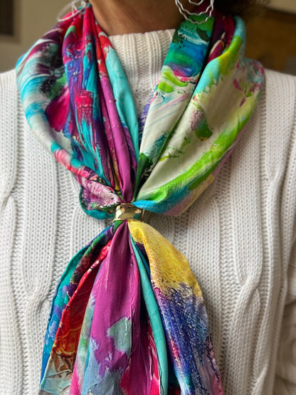 Colorful silk twill scarf with a floral abstract pattern worn over a white sweater-unleashed petals by Inspired Floral Designs NYC 