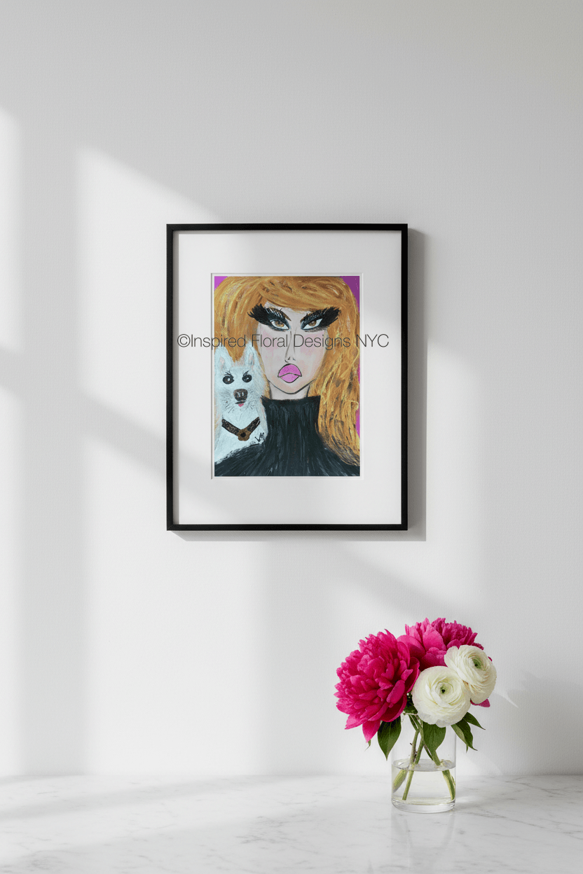 Framed artwork of a stylized face with a small white dog on a white wall with a vase of flowers below by Whitney inspired floral designs nyc llc copyright