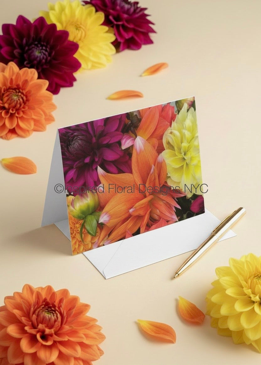 floral bouquet card by inspired floral designs nyc llc with bright colored flowers around and a pen with an envelop copyright 