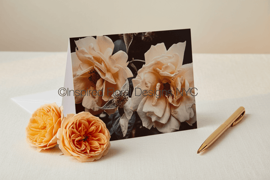 Floral card by Whitney with flowers and a pen on a white surface inspired floral designs nyc copyright 