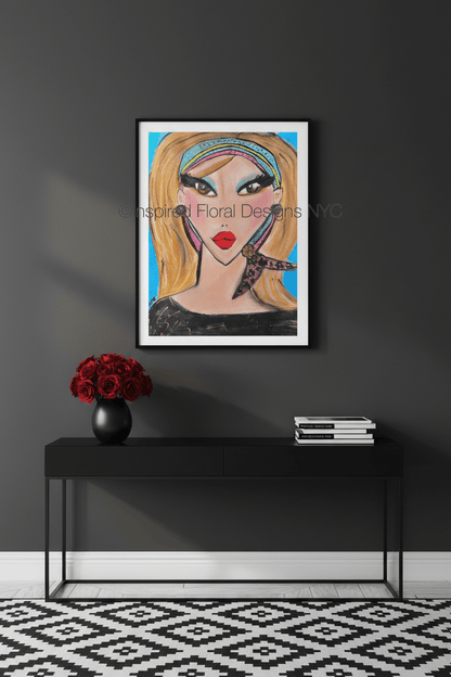 Framed artwork of a stylized woman's face on a dark wall above a black console table by whitney inspired floral designs nyc llc copyright